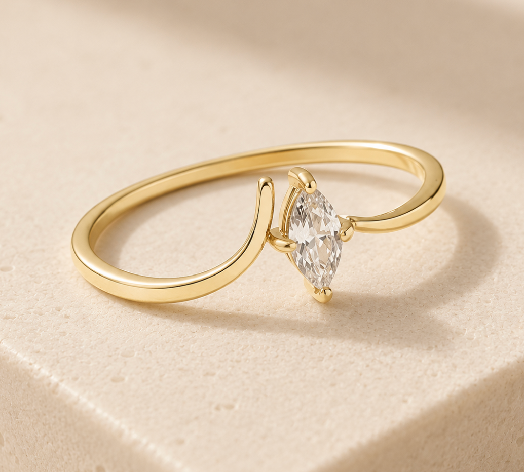 Afterlight Ring, 18k gold-plated waterproof ring by Golden Hour, fine wraparound band with a marquise-cut clear stone, tarnish-resistant and hypoallergenic